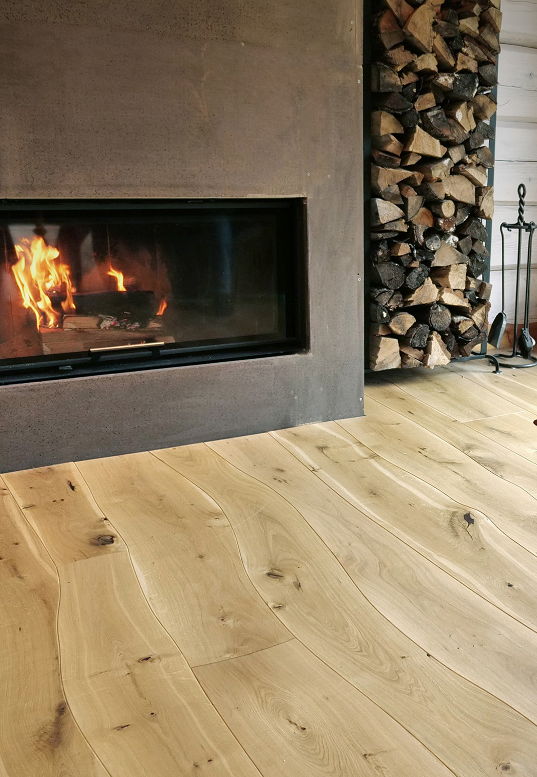 Oak Live edge curved flooring with fireplace in a log house